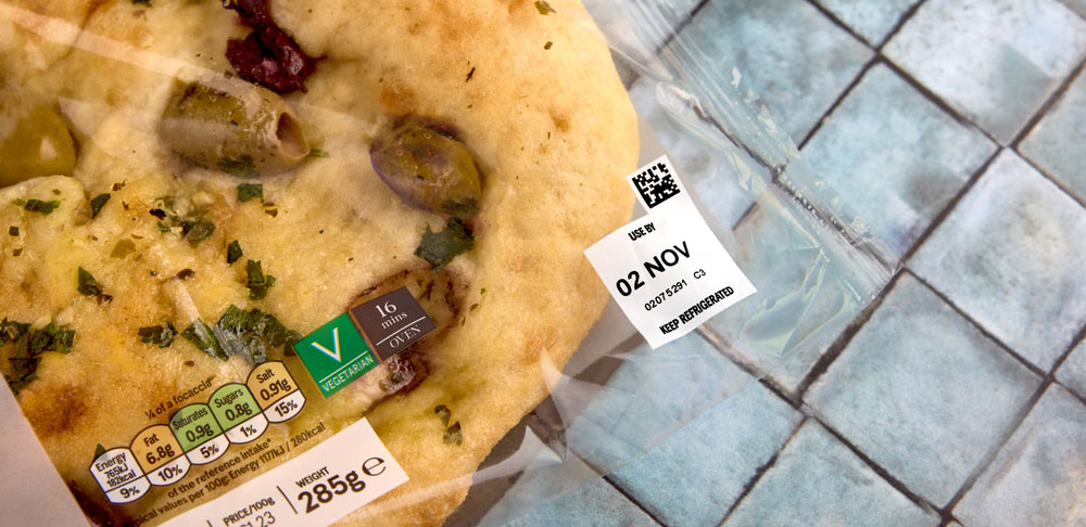 Thermal transfer overprinting on a flow-wrapped chilled food pack with use by date and 2D data matrix code